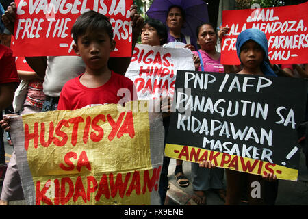 Philippines. 13th Apr, 2016. Young kids join the protest in front of the Department of Justice in Manila. Protesters lead by the group Bayan called for the unconditional release of the 71 farmers that were arrested following the violent dispersal last April 1, that left 2 dead and several people injured. According to Karapatan, a human rights group monitoring the detainees, a 6 month pregnant woman and a 78 year old lady are among the detainees. Credit:  J Gerard Seguia/ZUMA Wire/Alamy Live News Stock Photo