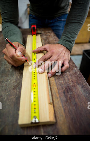 Carpenter working on his craft Stock Photo