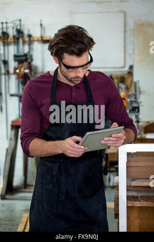 carpenter using his tablet Stock Photo