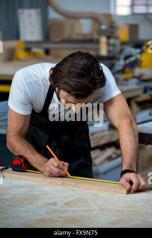 Carpenter working on his craft Stock Photo