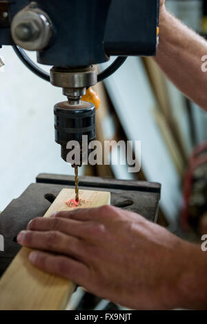 Carpenter using a drill Stock Photo