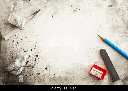 Paper with Pencil, Eraser, Charcoal, Smudges, Messy Marks and Copy Space. Stock Photo