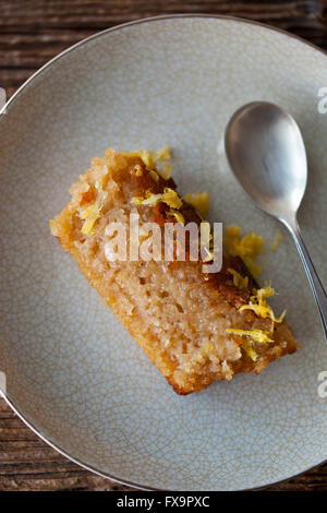 Slice of lemon and olive oil cake on a plate Stock Photo