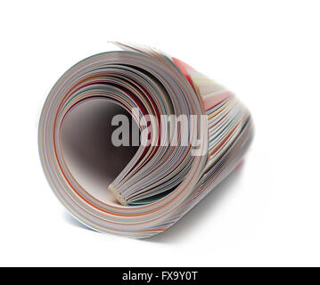 Rolled up magazine on white Stock Photo