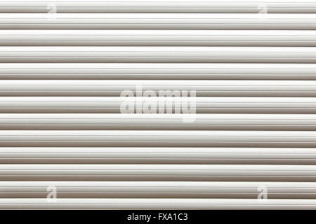 Roller shutter door. Striped textured white garage door background Stock Photo