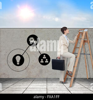 Composite image of businessman looking on a ladder Stock Photo