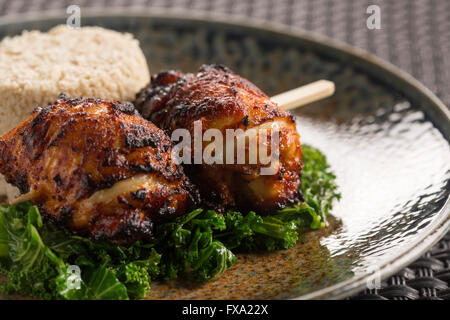 Korean BBQ Bulgogi Chicken with cauliflower rice & greens Stock Photo