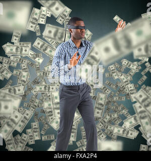 Composite image of blindfolded businessman with arms out Stock Photo