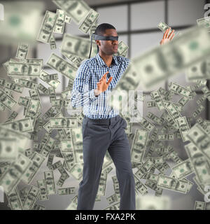 Composite image of blindfolded businessman with arms out Stock Photo