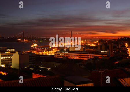 View from Miradouro de Santa Catania on the Bairro Alto and Ponte 25 de Abril at dusk, Lisbon, Portugal Stock Photo