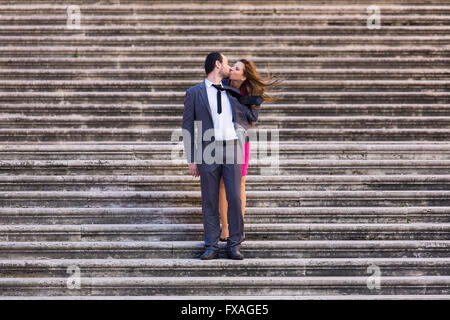 Couple kissing on stairs, Rome, Italy Stock Photo
