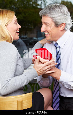 Man making proposal of marriage to his happy woman Stock Photo
