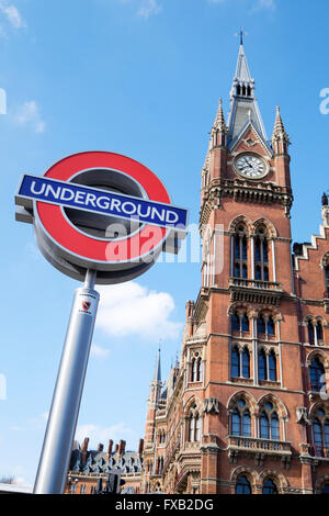 London underground tube sign and the Victorian clock tower of St Pancras station, London, England, UK Stock Photo