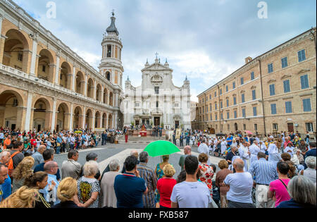 tourists and pilgrims in front of famous Shrine of the Holy House church in Loreto, Italy. Stock Photo