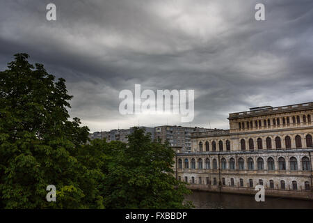 Dark clouds asperatus before the storm over city Stock Photo