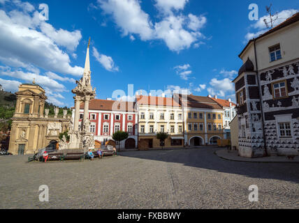 Dietrichstein tomb, Holy Trinity Statue (Plague Column) and Sgraffito house at central square in Mikulov town, Czech Republic Stock Photo