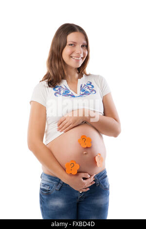 Pregnant woman with stick notes on her belly Stock Photo