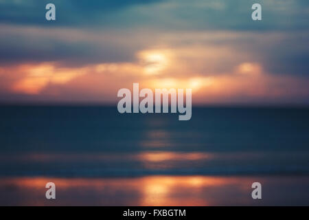 Blurred Image of Seascape with Sunset. Vintage Cross-processed Color. Stock Photo