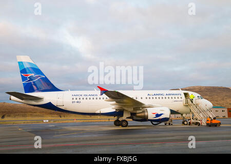 Preparing Atlantic Airways plane at Vagar Airport, Faroe Islands, Denmark in April - Faroes - Atlantic Airways Airbus A319-112 Stock Photo