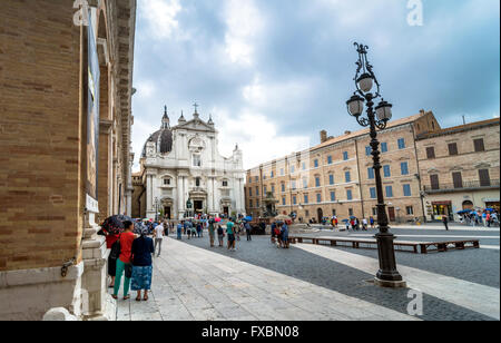 tourists and pilgrims in front of famous Shrine of the Holy House church in Loreto, Italy. Stock Photo