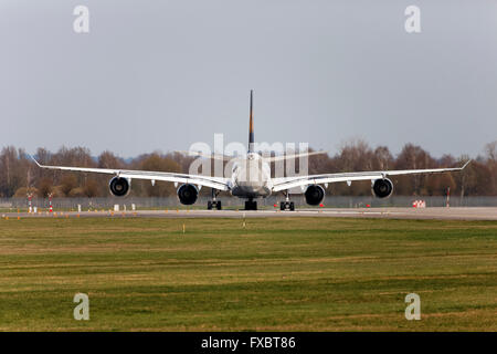 Rear view of a Lufthansa Airbus A340-642 waiting on runway for clearance before take off , Franz Josef Strauss Airport, Munich, Stock Photo
