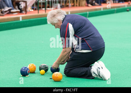 Melton Mowbray, Leicestershire,UK. 13th April 2016. English Indoor Bowling Association National Championships held at Melton and District Indoor Bowls Club. The quarter finals of the ladies and mens Nationa triples teams being played out. Credit:  Jim Harrison/Alamy Live News Stock Photo