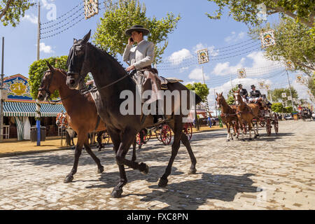 Seville, Spain. 14th Apr, 2016. Horsemen and typical chariot at the ''Feria de Abril'' (April's Fair) 2016 © Daniel Gonzalez Acuna/ZUMA Wire/Alamy Live News Stock Photo
