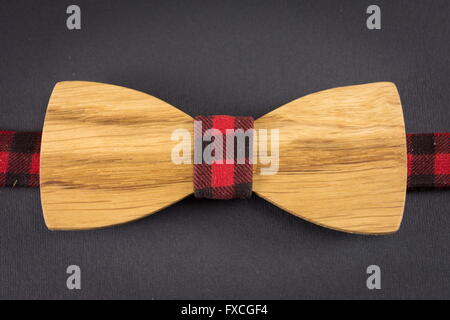 Wooden bow tie on a wooden table Stock Photo