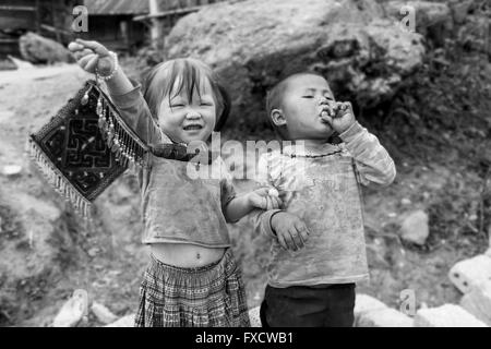 SaPa, Vietnam - March 2016 - Vietnamese kids from the villages around SaPa enjoying a piece of candy. Stock Photo