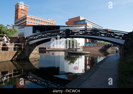 Cast Iron Bridge spanning a canal on the Birmingham Canal Network, England Stock Photo