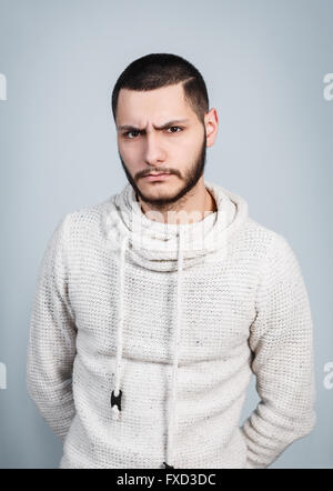 Young handsome man with serious face Stock Photo