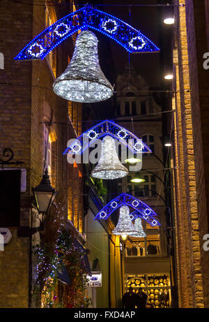 Silver Bell Christmas Lights In a narrow courtyard ,London Stock Photo