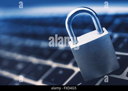 Data Security Encryption Photo Concept with Metallic Padlock on Laptop Computer Keyboard. Stock Photo