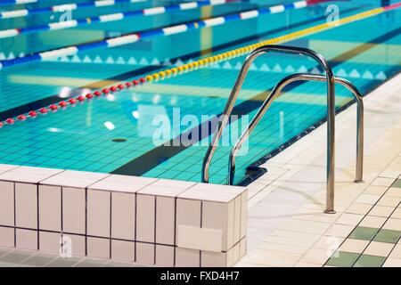 Public Swimming Pool. Swimming Pool Ladder Closeup. Stock Photo