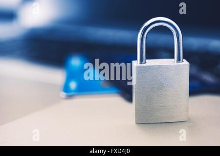 Secured Payments Concept with Metallic Padlock and Credit Cards in the Background. Stock Photo