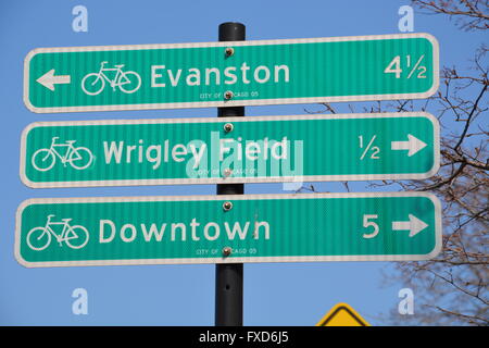 Bicycling directional and distance signs in the Lakeview neighborhood of Chicago. Stock Photo