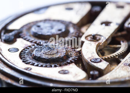 close up of an old pocket watch with rusty gears as a concept Stock Photo