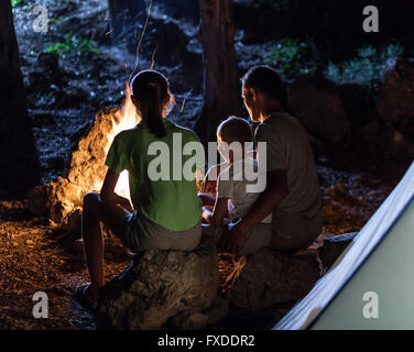 Family in the camping at night Stock Photo