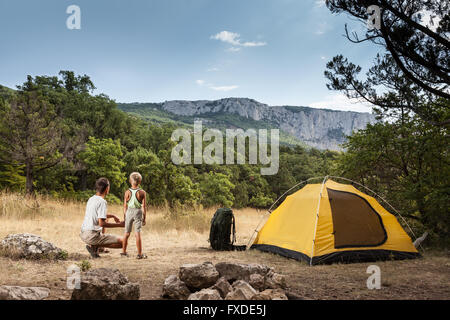 Father with son in the summer camping Stock Photo