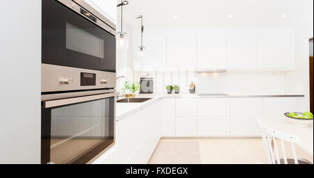 Modern stylish Scandinavian kitchen interior with kitchen accessories.  Bright white kitchen with household items Stock Photo - Alamy