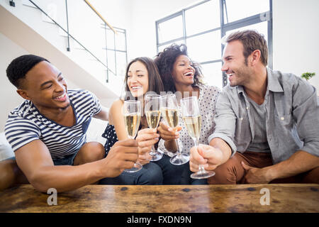 Friends toasting glasses of champagne Stock Photo