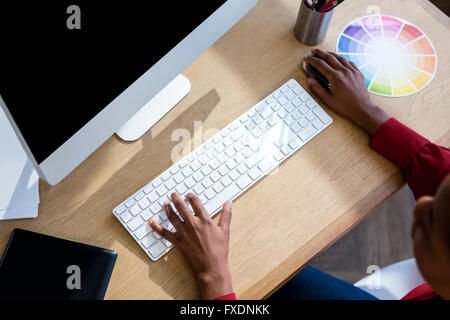 Woman working on computer Stock Photo