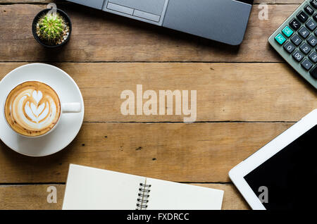 Office stuff with laptop, tablet, coffee cup ,calculate and notebook.Top view with copy space Stock Photo