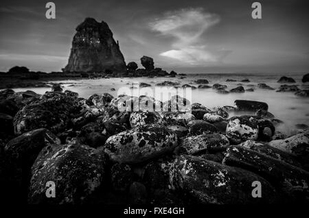 Rocks of all sizes at Papuma Beach In Java, Indonesia Stock Photo