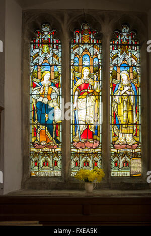 A memorial stained glass window in LACOCK village church in Wiltshire UK Stock Photo