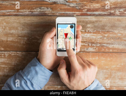 close up of male hands with smartphone on table Stock Photo