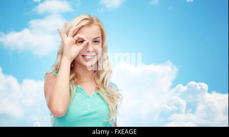 young woman making ok hand gesture Stock Photo