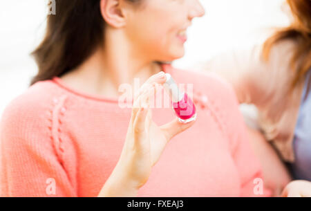 close up of smiling young woman with nail polish Stock Photo