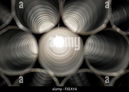 Metallic Pipes stacked in rows pattern Stock Photo