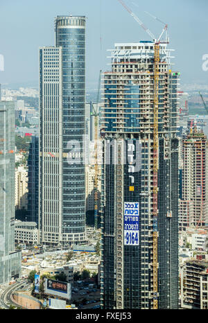 Tel Aviv city in Israel. Aerial view from observation deck in Azrieli Center Circular Tower with Moshe Aviv Tower on background Stock Photo